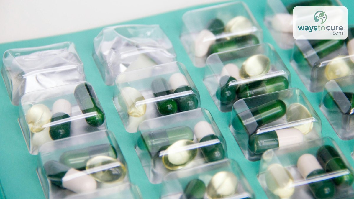 Green and white capsules in a clear blister pack