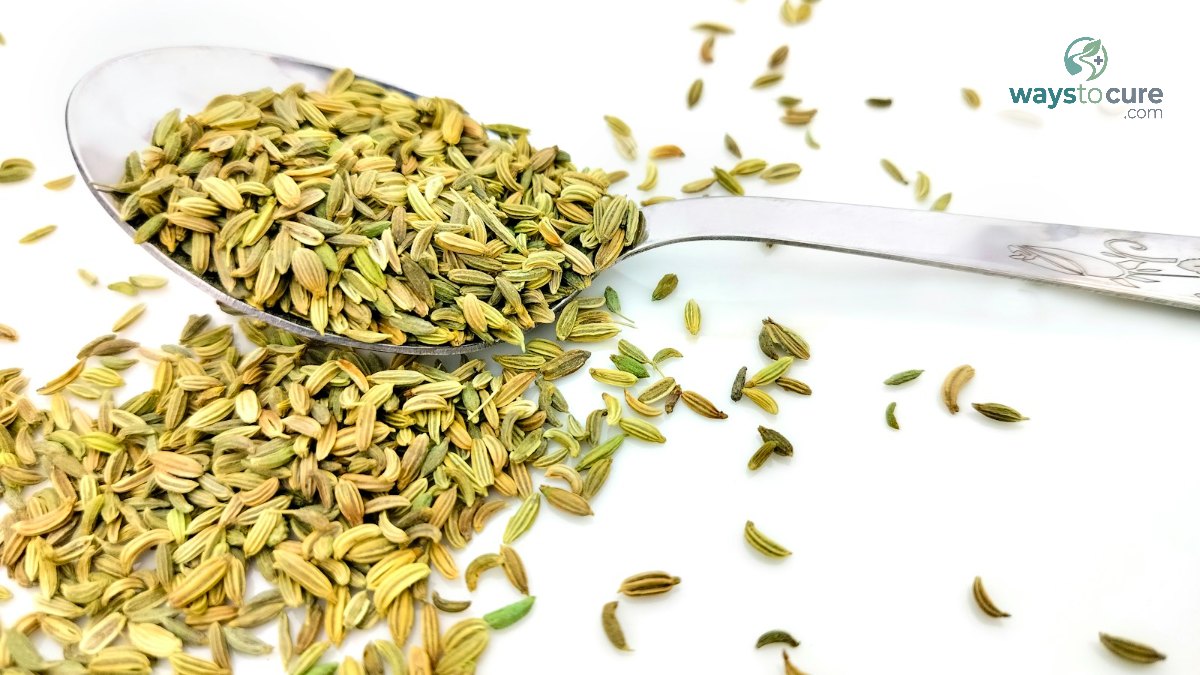 A spoonful of fennel seeds on a white table