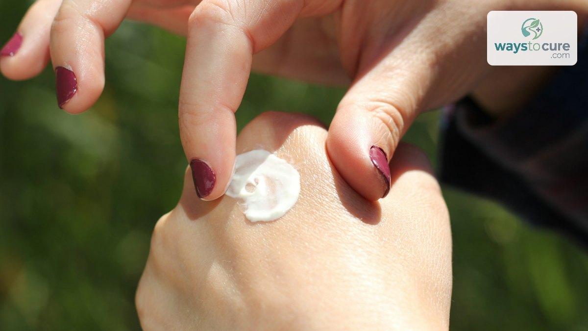 A dab of white moisturising cream being applied to the back of a hand